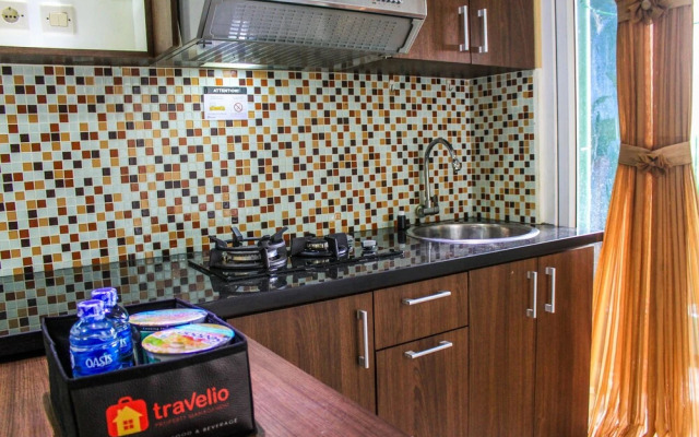 Comfortable and Tranquil 2BR Apartment at Green Pramuka By Travelio