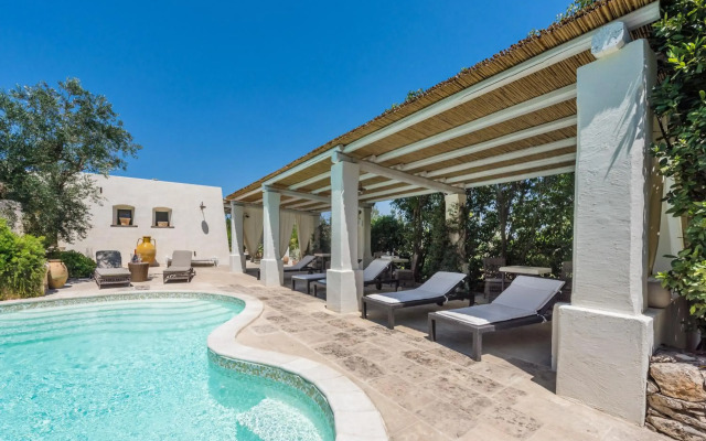 Modern Pool And Ancient Trullo