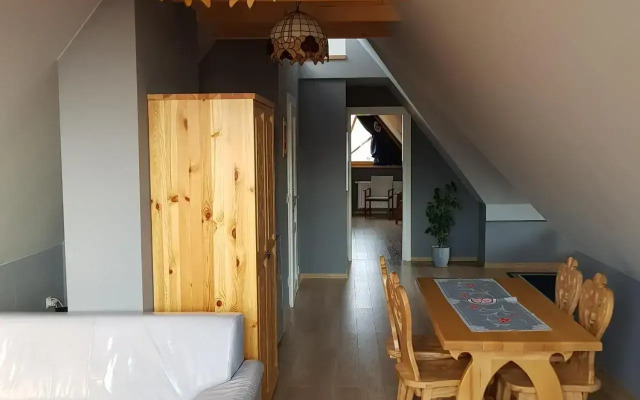 Domek za Strugiem - pokoje i apartamenty