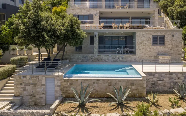 Beachfront Villa Poseidon with Heated Pool