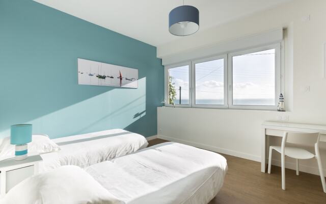 Maison vue mer les pieds dans l'eau