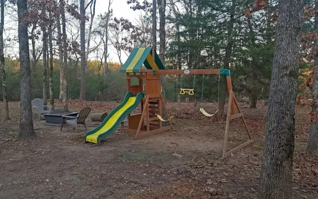 Cast Away Family Cabin with Hot Tub, Fireplace, and Kids Area by RedAwning