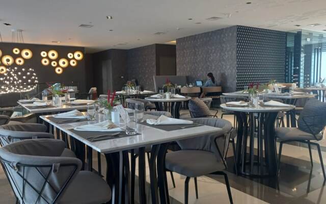 Capital O 950 Acqua Novotel Tower