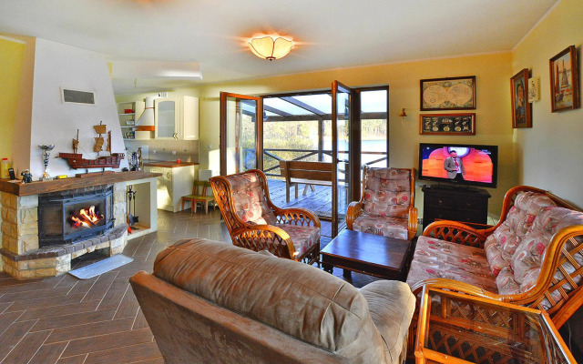 Holiday Home by Lake Rosnowskie With Boat