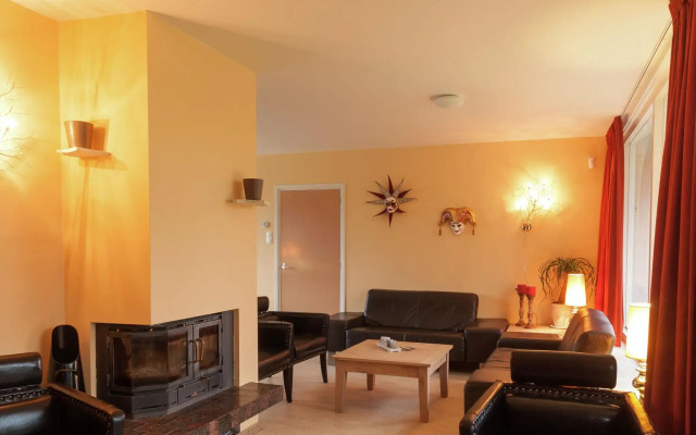 Cozy decorated house with fireplace, surrounded by forest