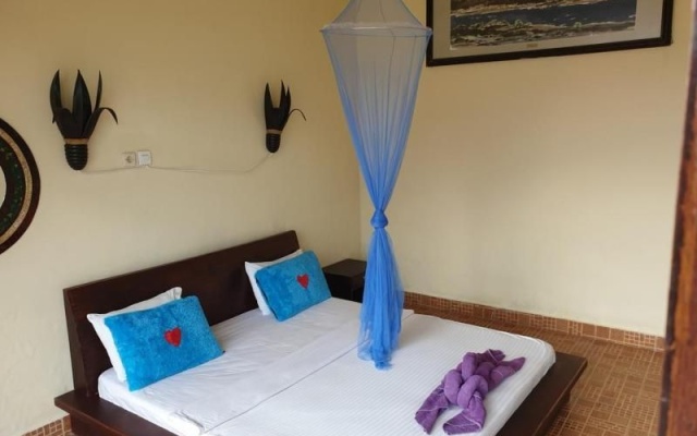 Penginapan Lakeside Cottages by ZUZU – Guest Rooms – Kintamani