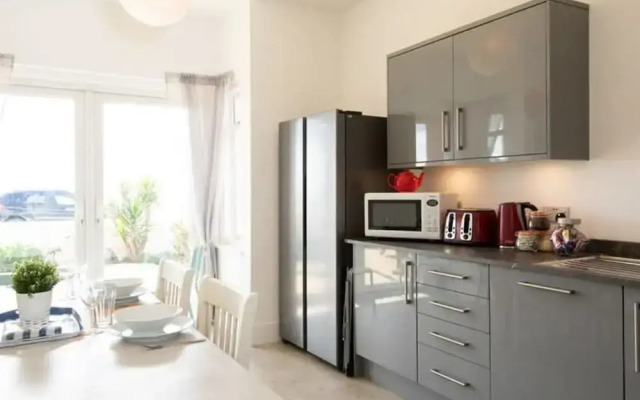 Absolute Beachfront With Decked Garden Oasis and Views