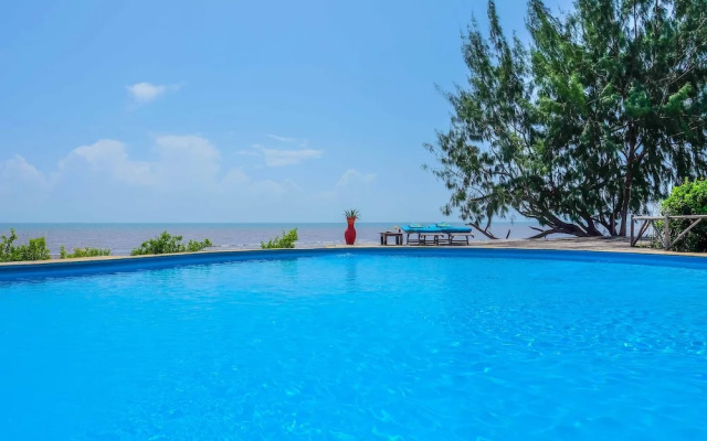 Saadani Safari Lodge - bush, river, beach