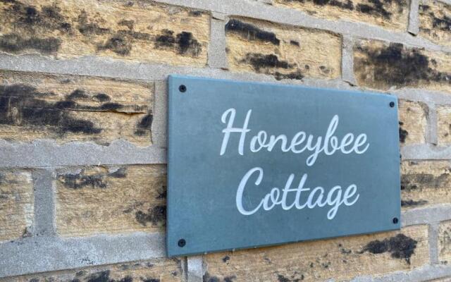 Honeybee Cottage, with a log fire & a hot tub.