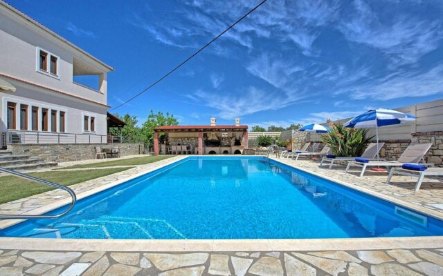 Acharavi Beach Villa by MediterraneanVillas