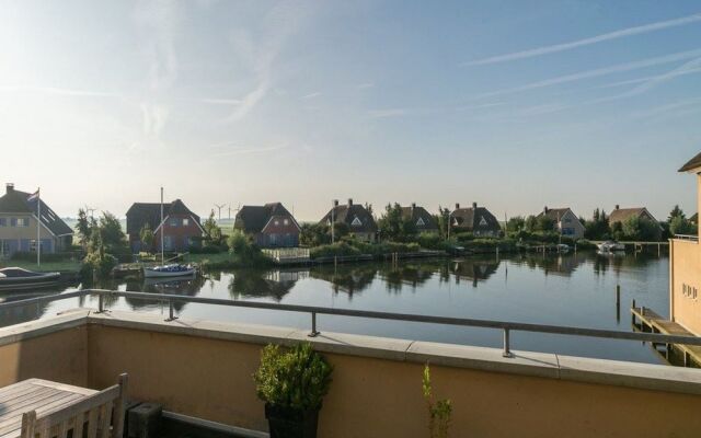 Exclusive Holiday Home Floating on a Lake in Friesland