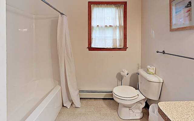 Woodsy Cape Cod Home by RedAwning