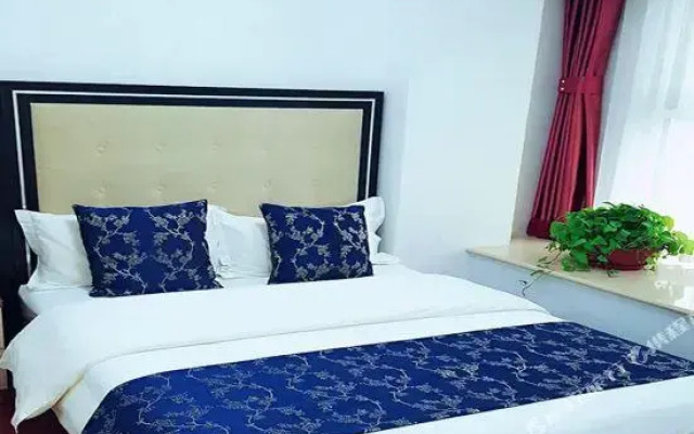 Guan County Hong Pu Traders Hotel
