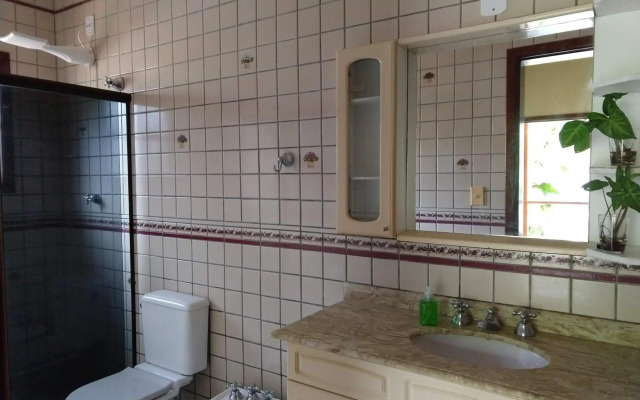 Casa 5 suítes com piscina e churrasqueira