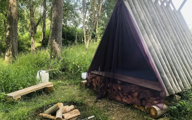 Tiny hut in the Forest Overlooking the River