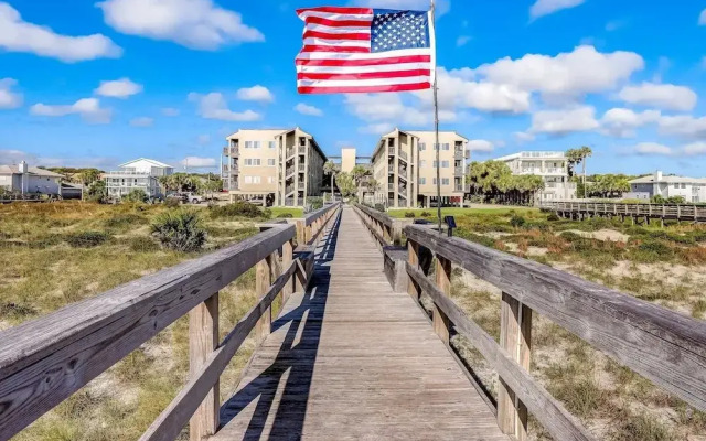 Newly Remodeled Oceanfront Condo with Salt Water Pool and Private Walkway to Beach by RedAwning