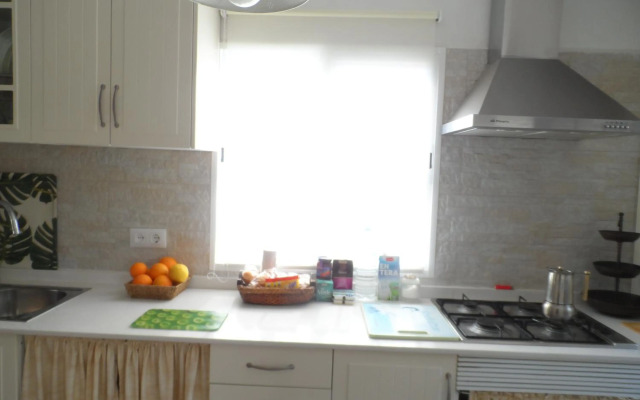 Casa con jardín frente Playa de Burriana