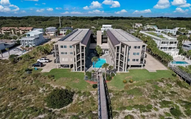 Newly Remodeled Oceanfront Condo with Salt Water Pool and Private Walkway to Beach by RedAwning