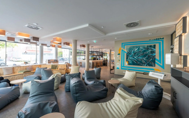 Отель Holiday Inn - the niu, Timber Esslingen, an IHG Hotel