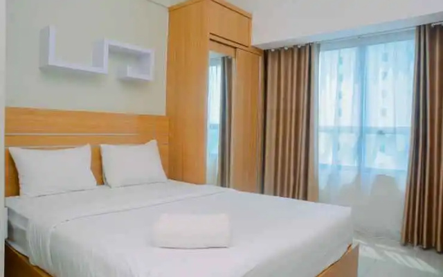 New Furnsihed Studio Room Apartment at Springlake Bekasi By Travelio