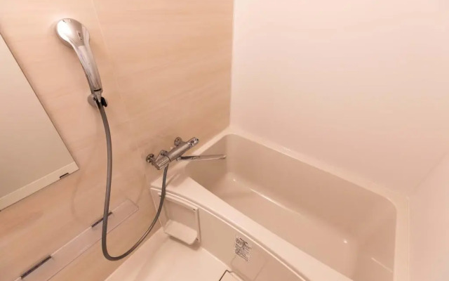 Mr.KINJO in front of Manza Beach