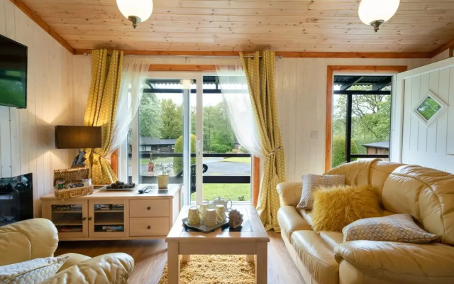 "catkin Lodge set in a Beautiful 24 Acre Woodland Holiday Park"