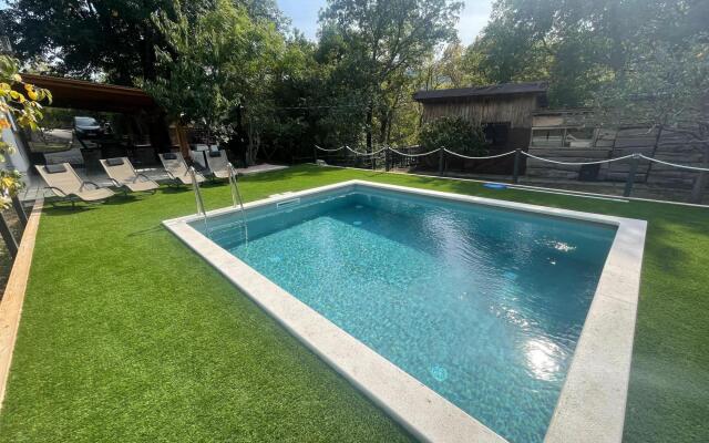 Vacation home with private swimming pool surrounded by nature