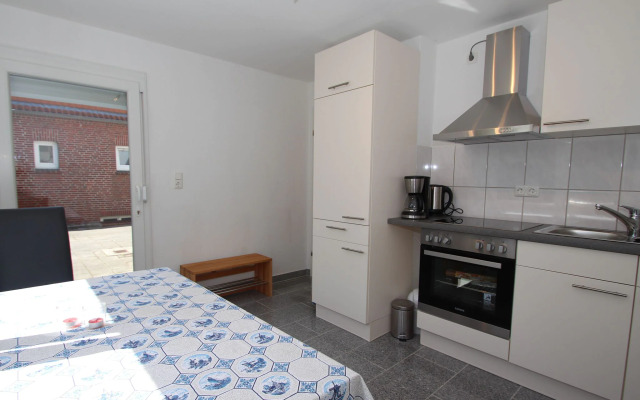 Apartment With a High Chair and bed