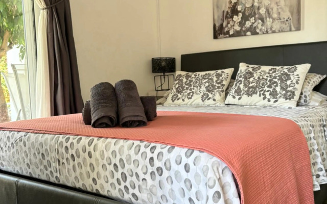 Mediterranean poolside garden cottage