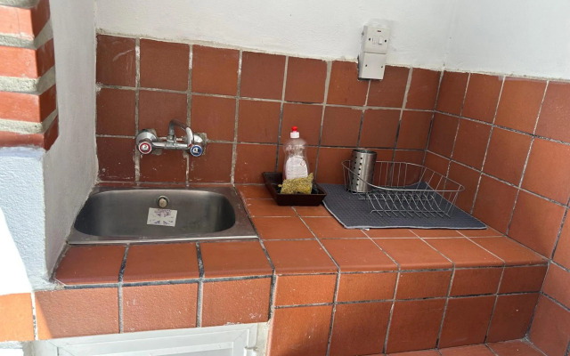 Mediterranean poolside garden cottage