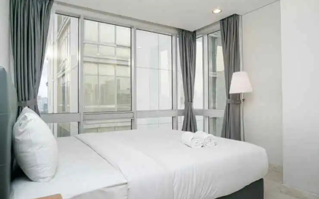 2BR Cozy at Empyreal Epicentrum Apartment By Travelio