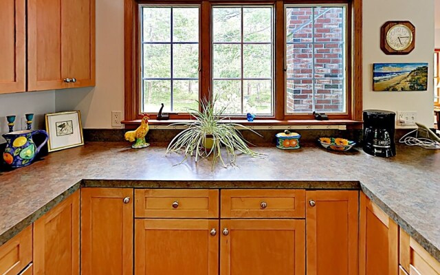 Woodsy Cape Cod Home by RedAwning