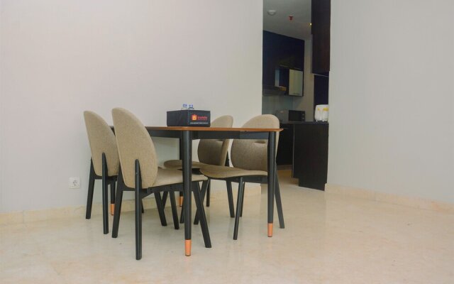 Comfy and Spacious 2BR The Masterpiece Epicentrum Apartment By Travelio