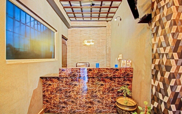 The Rosewood Hotel by OYO Rooms