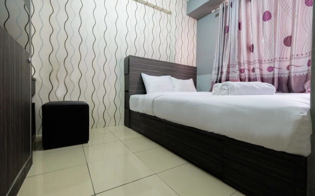 Monochrome Style 2 Bedrooms at Kalibata City Apartment By Travelio