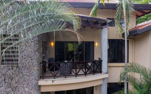 Modern Island-Themed Condo with Floor-to-Ceiling Windows & Garden and Pool Views Within Walking Distance of the Beach