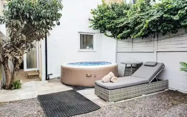 Central 3BR Home with Hot Tub Sleeps 10