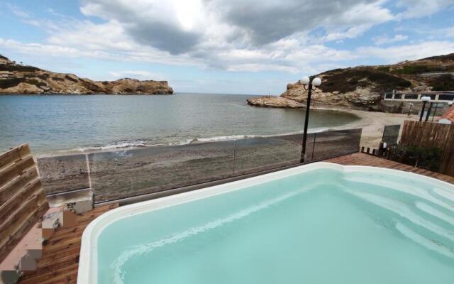 Beach front apartment with swimming pool