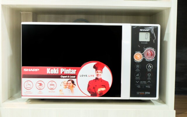 Studio Room Azalea Suites Apartment By Travelio