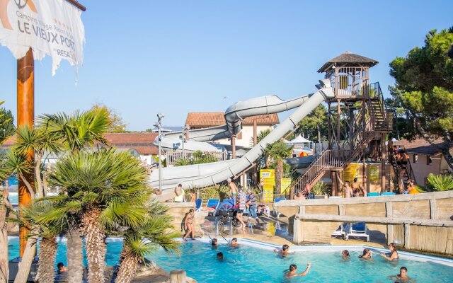 Cozy Mobile Home With Covered Terrace on a Luxury Campsite