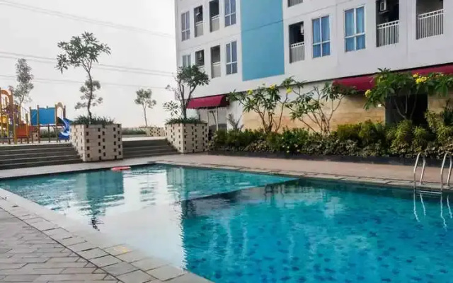 Cozy Studio Grand Dhika City Apartment By Travelio