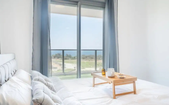 Vibrant Seaside Stay with Balcony by Sea N' Rent