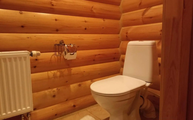 Log house with a Russian wood-burning sauna