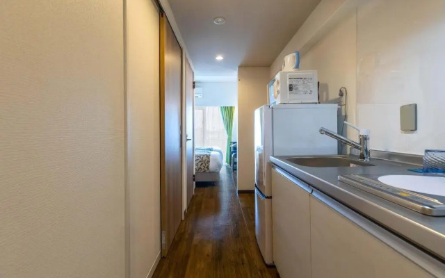 Mr.KINJO in front of Manza Beach