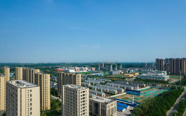 Ginza Jiayue Select Hotel (Qihe Wanda Plaza Spring City Oulebao)