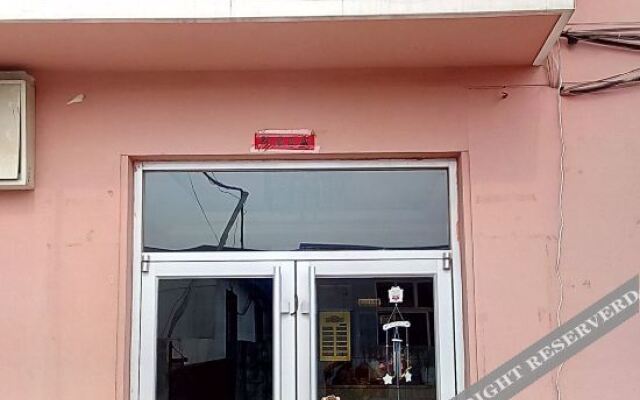 Pingdu New Home Business Hotel