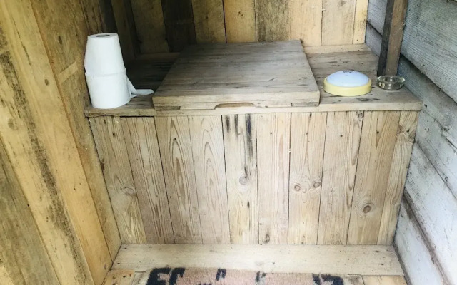 Tiny hut in the Forest Overlooking the River