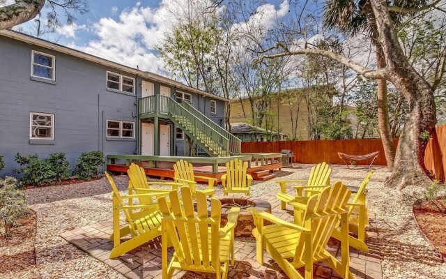 Vibrant, Colorful Condo Building With Backyard Firepit and Games