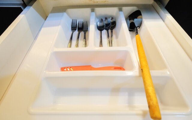 Monochrome Style 2 Bedrooms at Kalibata City Apartment By Travelio