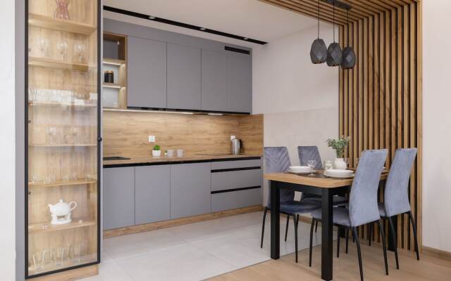 Dark Blue Apartment in Kraków by Renters